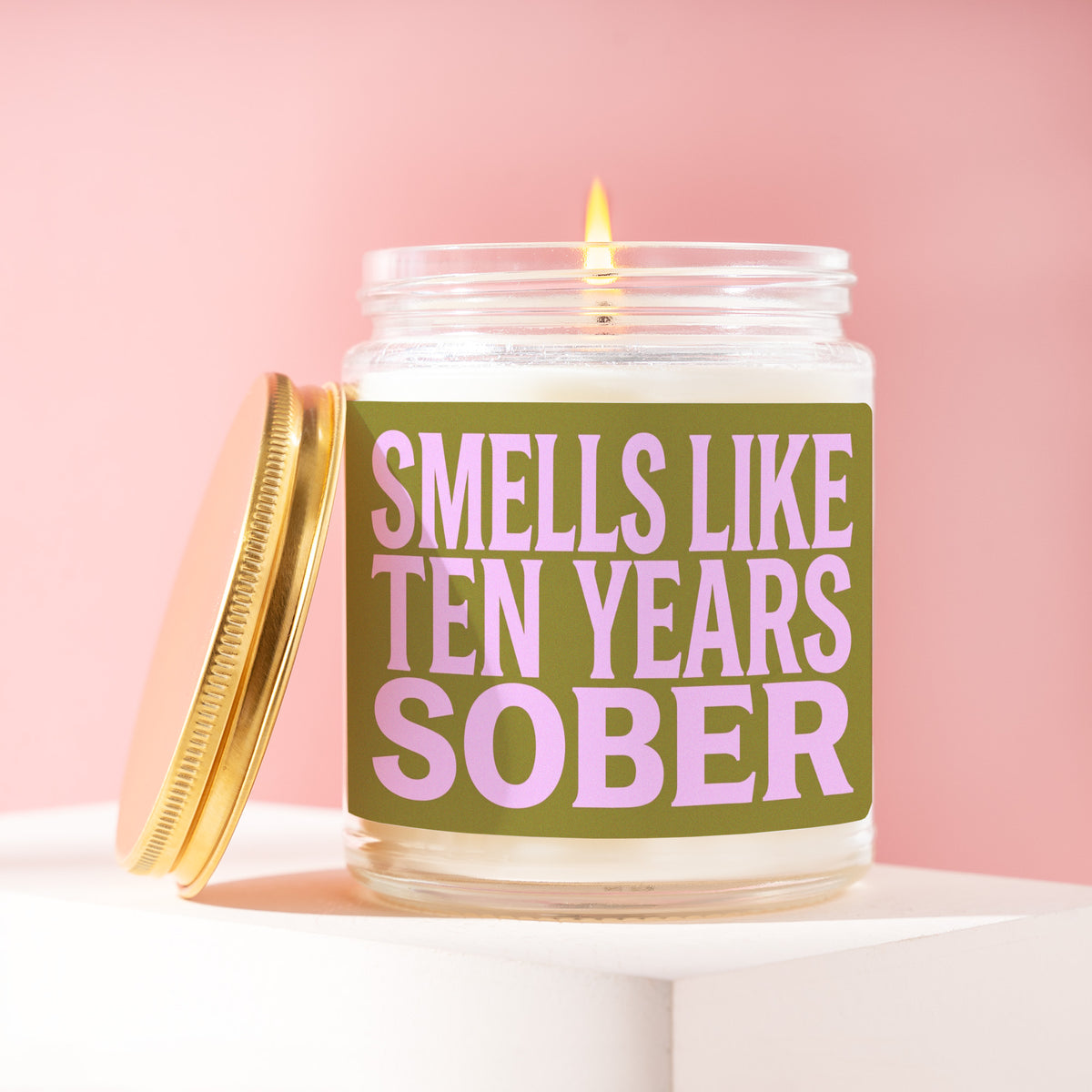 Smells Like Ten Years Sober 9 oz soy candle with a brushed gold lid by James Wax