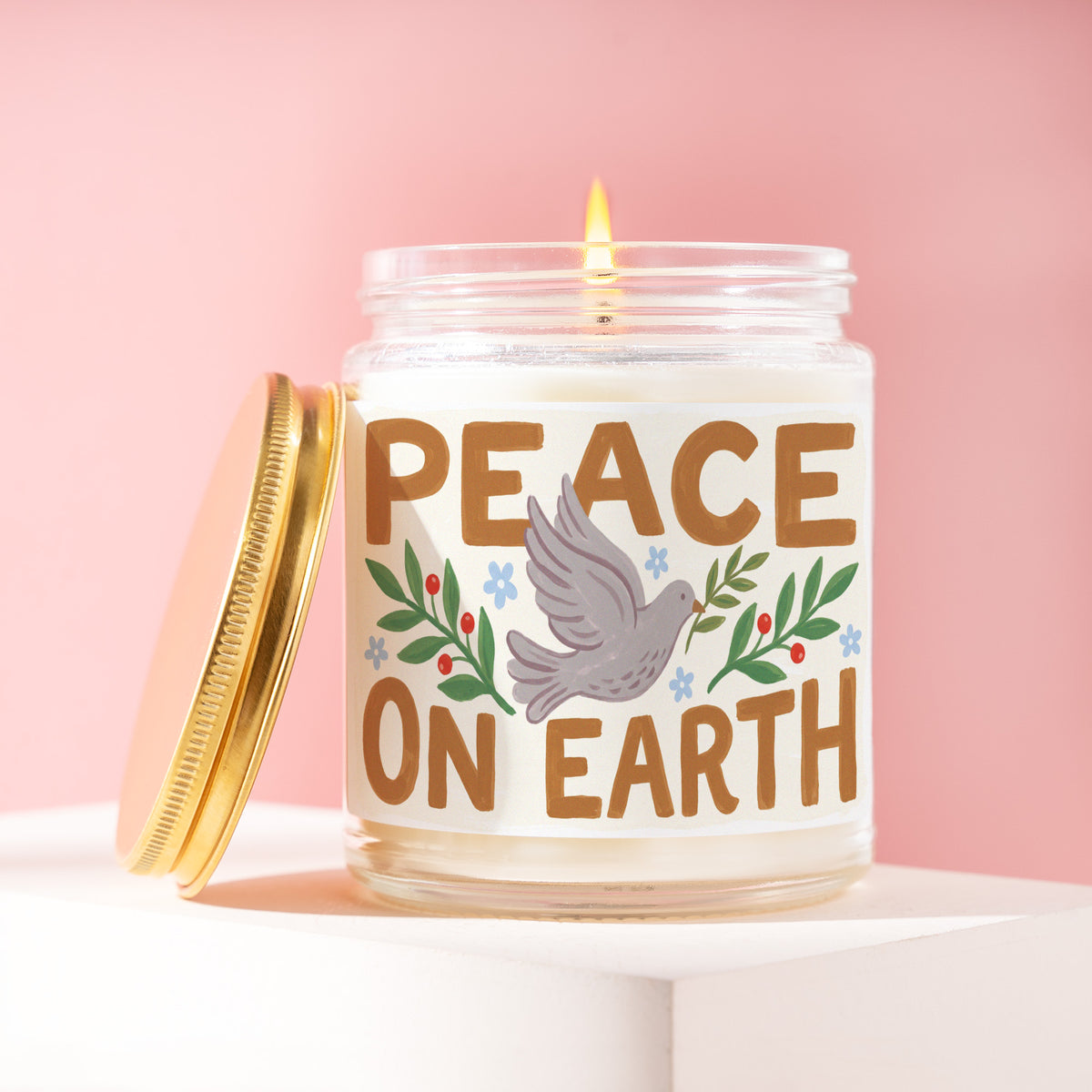 Peace On Earth 9 oz soy candle with a brushed gold lid by James Wax