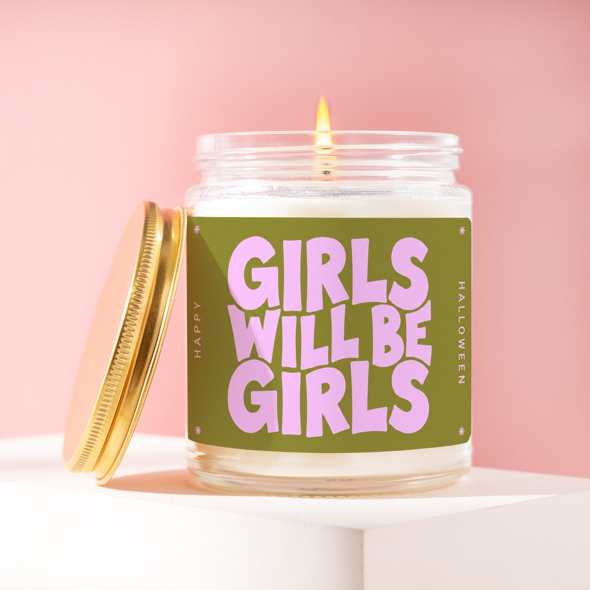 Girls Will Be Girls 9 oz soy candle with a brushed gold lid by James Wax