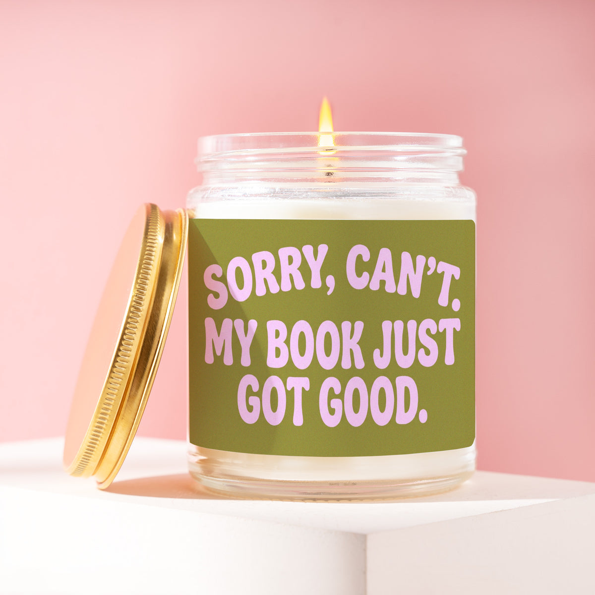 Sorry, Can't. My Book Just Got Good. 9 oz soy candle with a brushed gold lid by James Wax