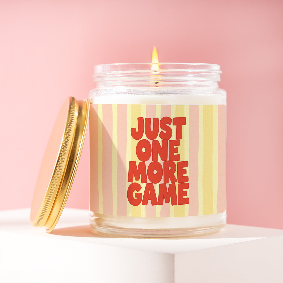 Just One More Game 9 oz soy candle with a brushed gold lid by James Wax