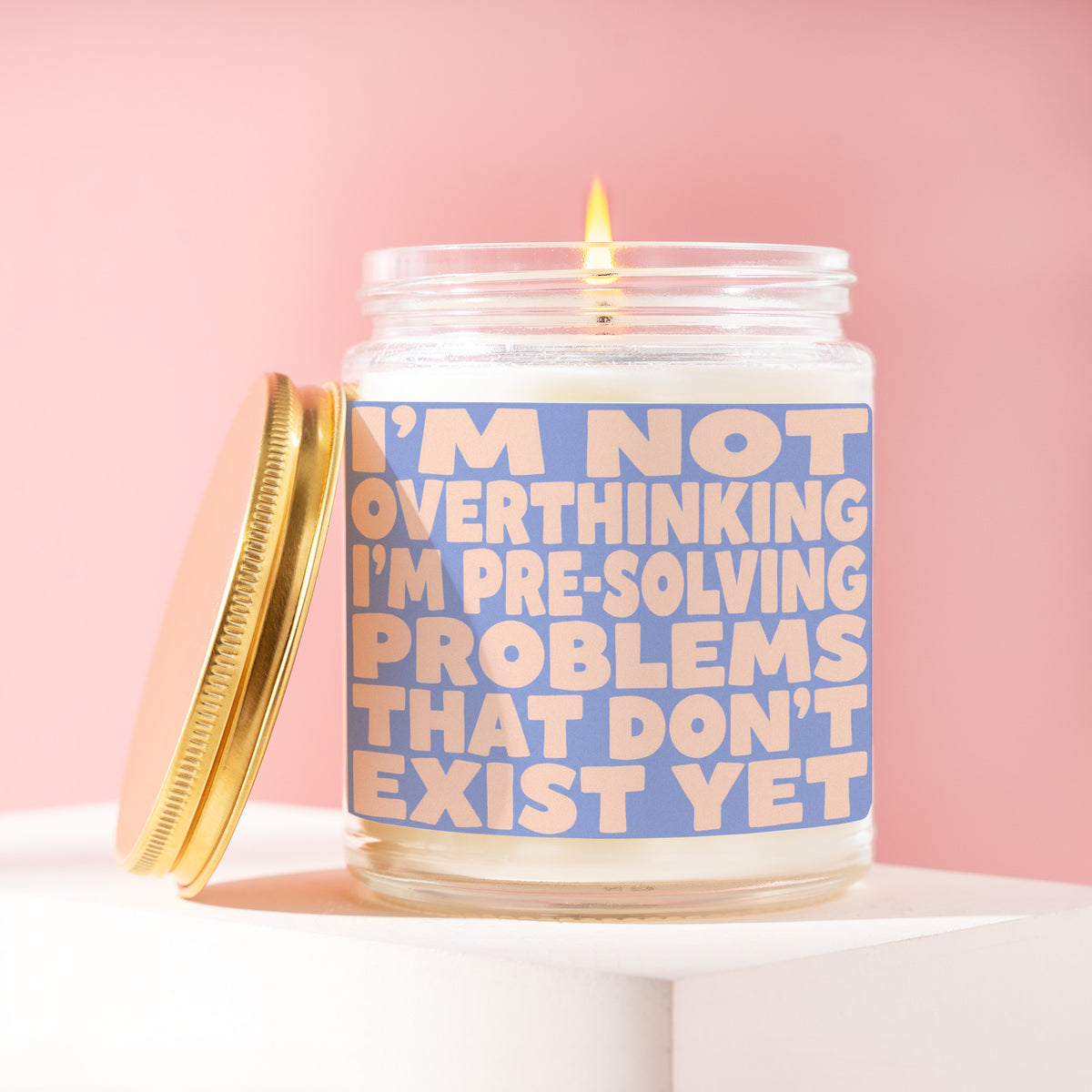 I'm Not Overthinking I'm Pre-Solving Problems That Don't Exist Yet 9 oz soy candle with a brushed gold lid by James Wax
