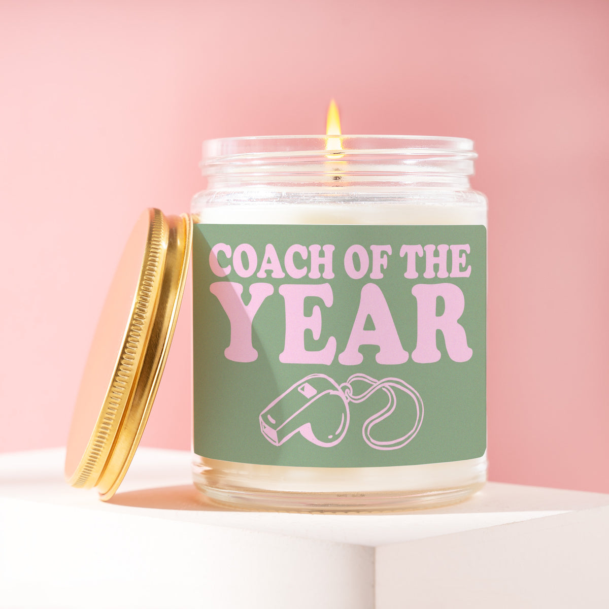 Coach Of The Year 9 oz soy candle with a brushed gold lid by James Wax